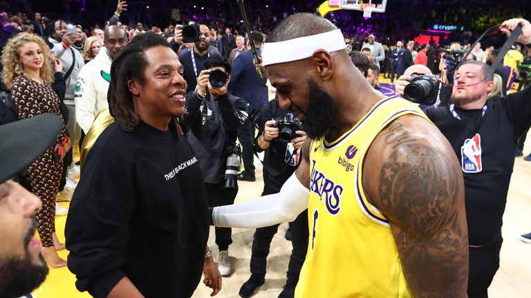 LeBron James celebrates with Jay-Z after becoming the NBA's all-time leading scorer