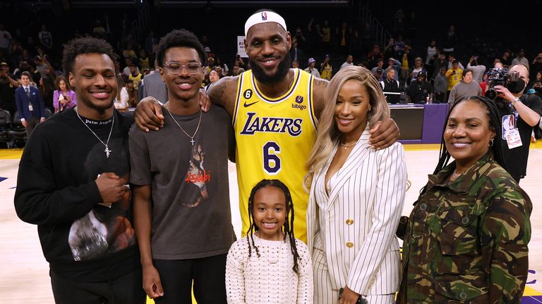 LeBron James poses with his sons Bronny and Bryce, daughter Zhuri, wife Savannah and mother Gloria after breaking Kareem Abdul-Jabbar's all-time NBA scoring record