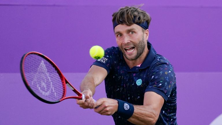 Liam Broady of Britain returns to Marin Cilic of Croatia, during their singles tennis match at Queens Club tournament, in London, Monday, June 13, 2022. (AP Photo/Alberto Pezzali)