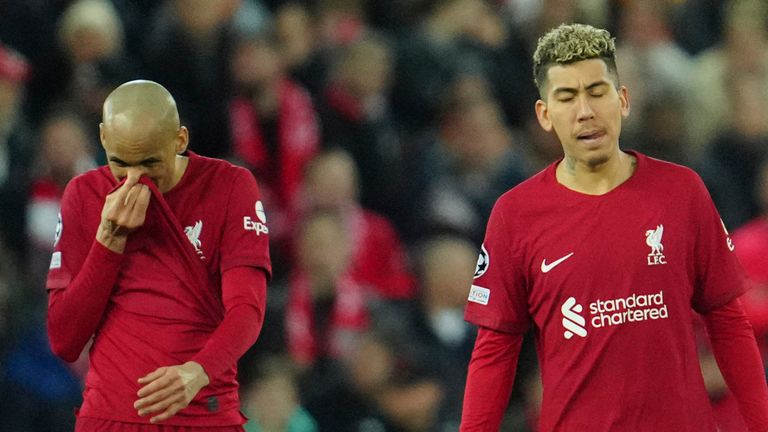 Liverpool players gesture after Real Madrid&#39;s Karim Benzema, scores his side&#39;s fifth goal during the Champions League, round of 16, first leg soccer match between Liverpool and Real Madrid at the Anfield stadium in Liverpool, England, Tuesday, Feb. 21, 2023. (AP Photo/Jon Super)