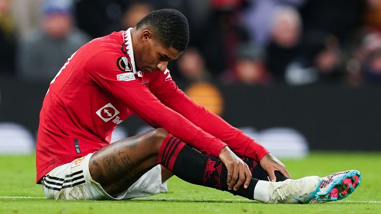 Manchester United's Marcus Rashford waits to receive treatment for an injury during the UEFA Europa League playoff match at Old Trafford, Manchester. Picture date: Thursday February 23, 2023.