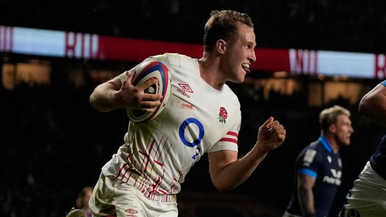 England's..Max Malins, left, celebrates after scoring his team's second try during the Six Nations rugby union international match between England and Scotland at Twickenham in London, England, Saturday, Feb. 4, 2023. (AP Photo/Alastair Grant)