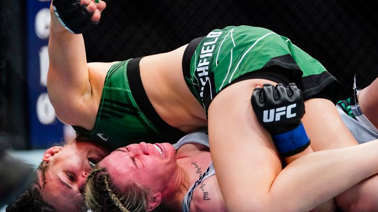 Erin Blanchfield, left, punches England&#39;s Molly McCann during the first round of a women&#39;s flyweight bout in the UFC 281