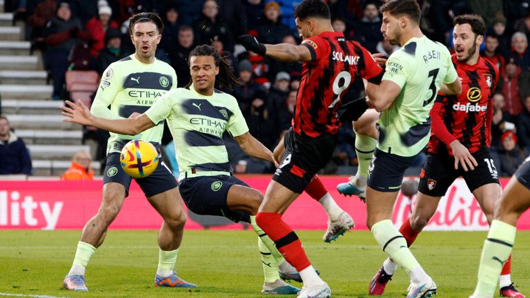 Nathan Ake tries to block a shot from Bournemouth's Dominic Solanke