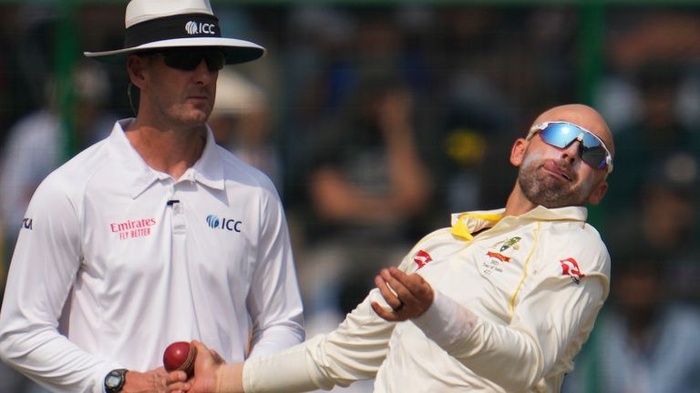 Australia&#39;s Nathan Lyon bowls during the second day of the second cricket test match between India and Australia in New Delhi, India, Saturday, Feb.18, 2023. (AP Photo/Altaf Qadri) 