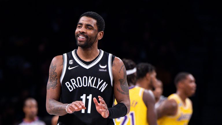 Brooklyn Nets guard Kyrie Irving (11) reacts during the second half of an NBA basketball game against the Los Angeles Lakers.