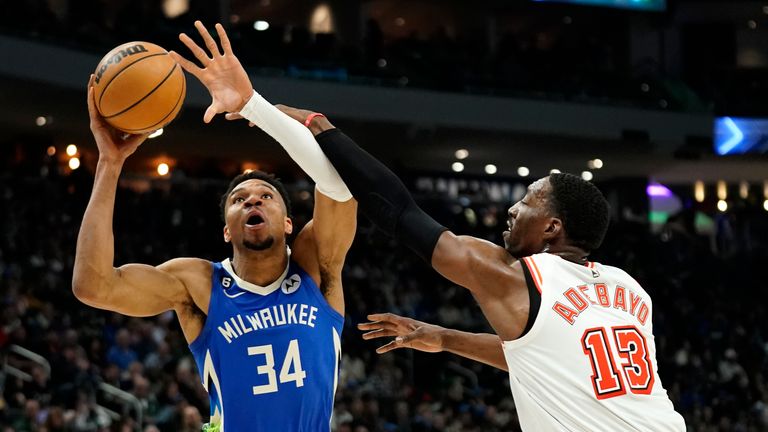Milwaukee Bucks&#39; Giannis Antetokounmpo (34) is fouled as he drives to the basket against Miami Heat&#39;s Bam Adebayo (13) during the second half of an NBA basketball game Saturday, Feb. 4, 2023, in Milwaukee.