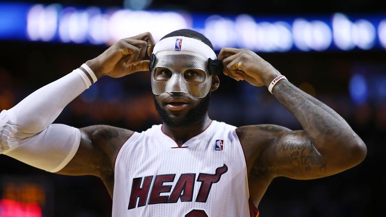 FILE - Miami Heat&#39;s LeBron James adjusts his protective mask during the first half of an NBA basketball game in Miami, Monday, March 3, 2014 against the Charlotte Bobcats. LeBron James is about to pass Kareem Abdul-Jabbar as the NBA&#39;s career scoring leader. The AP is looking back at some of his top games along the way.(AP Photo/J Pat Carter, File)


