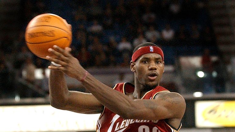 FILE - In this Oct. 29, 2003 file photo, Cleveland Cavaliers rookie guard LeBron James, passes as he drives the lane during his first regular season NBA basketball game, against the Sacramento Kings, at Arco Arena in Sacramento, Calif. 