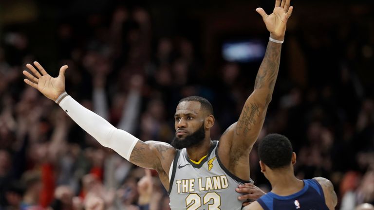 Cleveland Cavaliers&#39; LeBron James, left, celebrates after making the game-winning basket in overtime in an NBA basketball game against the Minnesota Timberwolves, Wednesday, Feb. 7, 2018, in Cleveland. The Cavaliers won 140-138 in overtime. (AP Photo/Tony Dejak)


