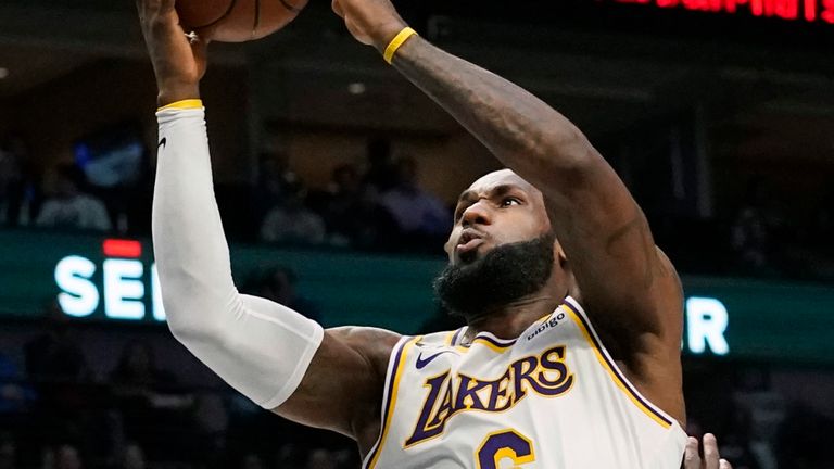 Los Angeles Lakers forward LeBron James misses a layup and injures his right foot against the Dallas Mavericks.