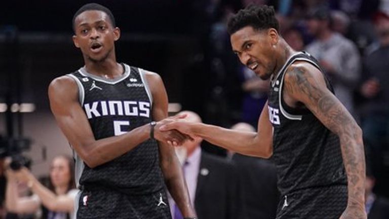 Malik Monk and De'Aaron Fox celebrate after a historic win over the Los Angeles Clippers.
