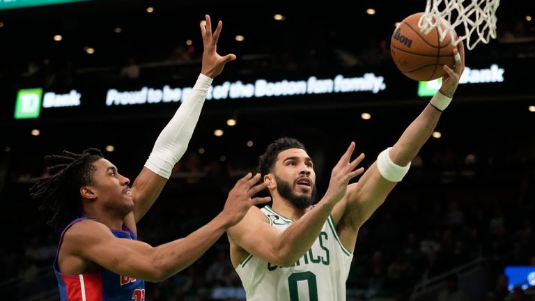 Boston Celtics forward Jayson Tatum drives to the basket past Detroit Pistons guard Jaden Ivey during the second half of an NBA basketball game, Wednesday, Feb. 15, 2023, in Boston. 