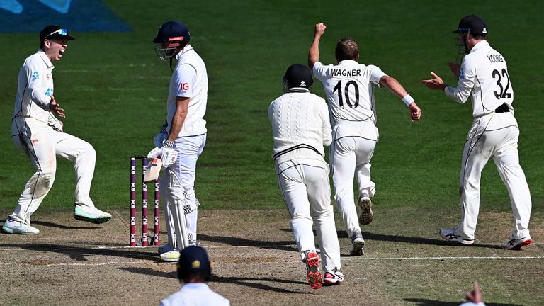 New Zealand's Neil Wagner, second right, celebrates with team-mates the wicket of England's James Anderson, second left, for their one-run win