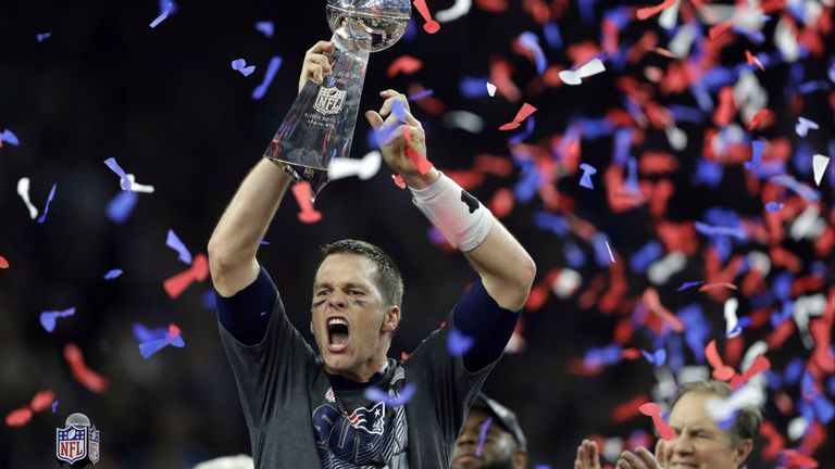 FILE - In this Feb. 5, 2017, file photo, New England Patriots&#39; Tom Brady raises the Vince Lombardi Trophy after defeating the Atlanta Falcons in overtime at the NFL Super Bowl 51 football game, in Houston. With five rings Tom Brady has already established himself as the most-decorated quarterback in Super Bowl history.