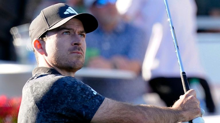 Nick Taylor watches his shot on the 16 th hole during the third round of the Phoenix Open golf tournament, Saturday, Feb. 11, 2023, in Scottsdale, Ariz. (AP Photo/Darryl Webb)
