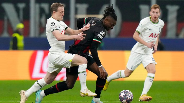 Oliver Skipp challenges Rafael Leao at San Siro