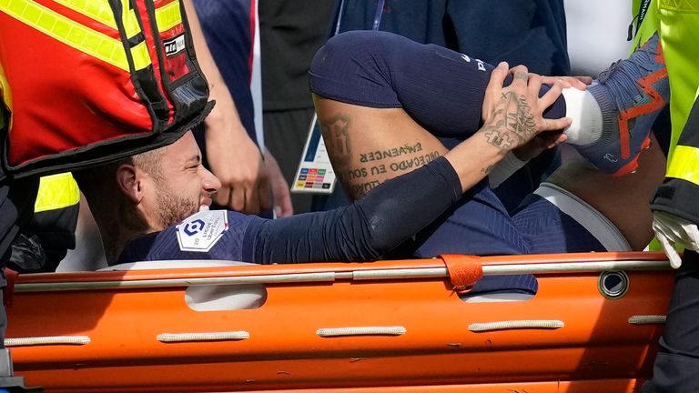 PSG&#39;s Neymar is carried off the field on a stretcher after after injuring during the French League One soccer match between Paris Saint-Germain and Lille at the Parc des Princes stadium, in Paris, France, Sunday, Feb. 19, 2023. (AP Photo/Christophe Ena)
