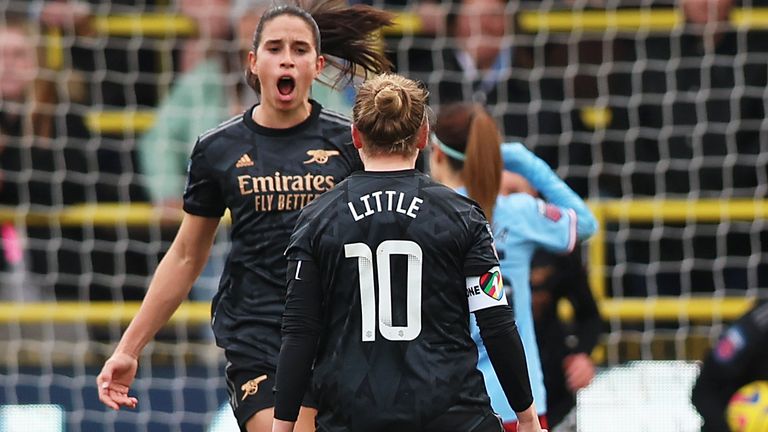 Rafaelle Souza celebrates with Kim Little after pulling a goal back for Arsenal