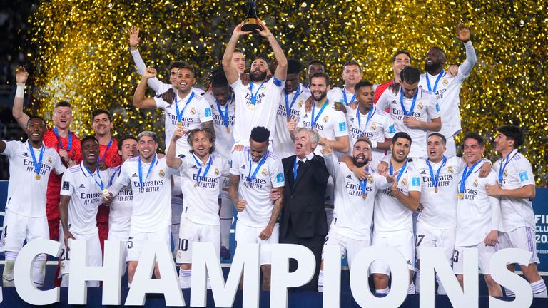 Real Madrid players celebrate with the trophy after winning the FIFA Club World Cup final match against Al Hilal at Prince Moulay Abdellah stadium in Rabat, Morocco, Saturday, February 11, 2023. Real Madrid beat Al Hilal 5-3.  (AP Photo/Manu Fernandez)