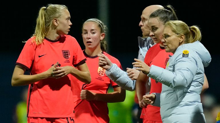 England's head coach Sarina Wiegman, centre, gives instructions to her players