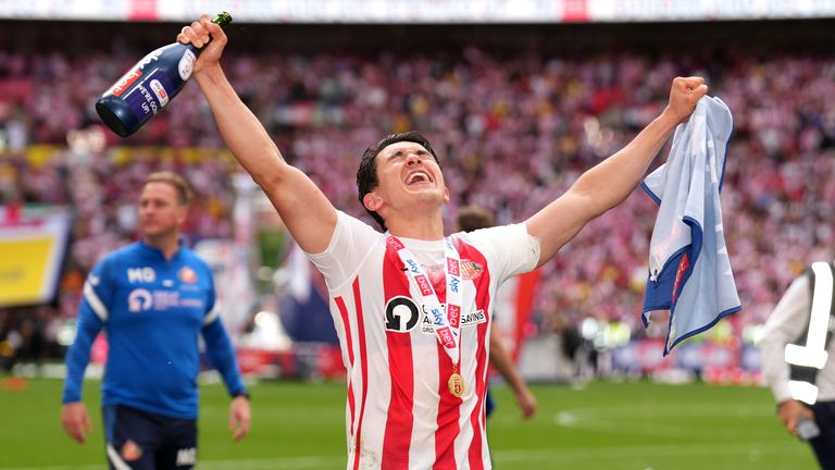Sunderland's Luke O'Nien celebrates with the trophy after the Sky Bet League One play-off final at Wembley Stadium, London. Picture date: Saturday May 21, 2022.