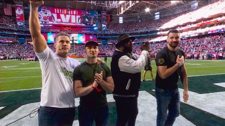 Kyle Brandt introducing Roman Boguslavskyi, Alfie Williams and Yurii Hundych on the field at the Super Bowl 