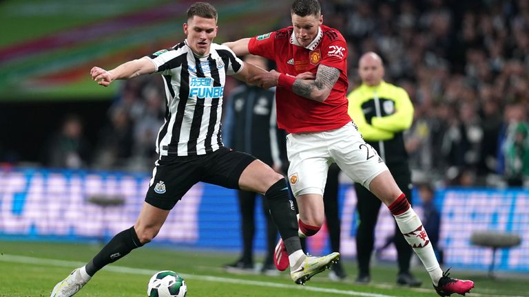 Newcastle United's Sven Botman (left) and Manchester United's Wout Weghorst battle for the ball