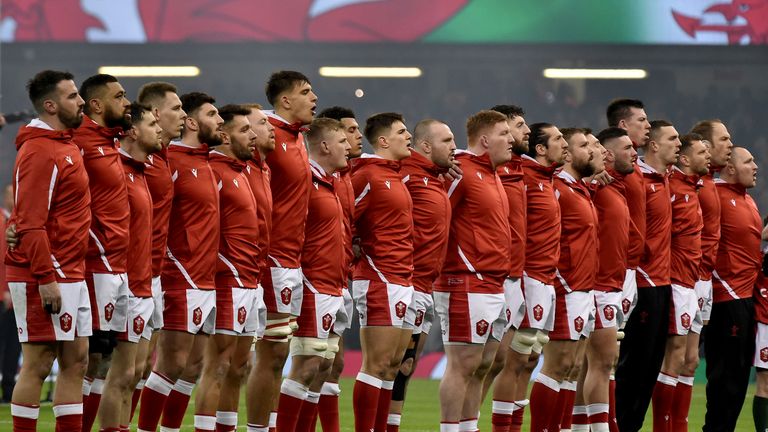 Wales players line up as they sing their national anthem before the start of the Six Nations rugby union international match between Wales and Ireland at the Principality Stadium in Cardiff, Wales, Saturday, Feb. 4, 2023. 