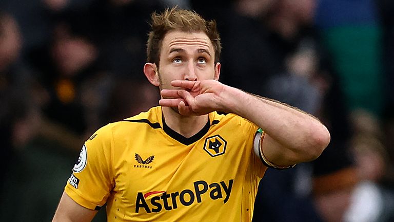 Craig Dawson celebrates after scoring against Liverpool on his Wolves debut