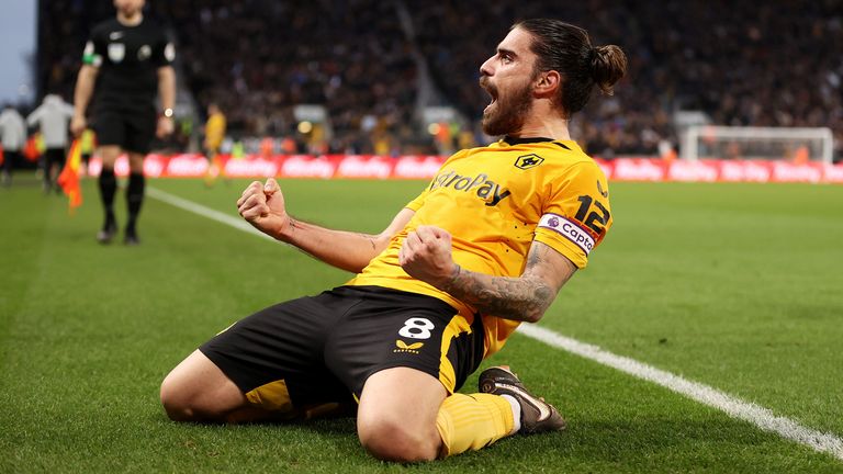 Ruben Neves celebrates after scoring Wolves' third goal against Liverpool