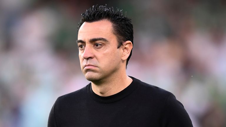 FILE - Barcelona's head coach Xavi Hernandez reacts during the Spanish La Liga soccer match between Real Betis and Barcelona at Benito Villamarin stadium in Seville, Spain, Saturday, May 7, 2022. Xavi has missed his team's flight for a preseason tour of the United States because of problems with his passport, the Spanish club said Saturday, July 16, 2022. (AP Photo/Jose Breton, File)
