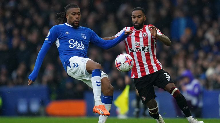 Everton's Alex Iwobi (left) and Brentford's Rico Henry battle for the ball