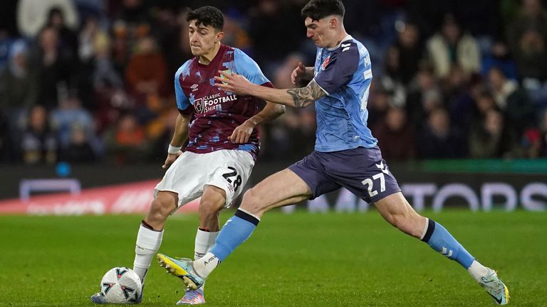 Burnley's Ameen Al-Dakhil (left) and Fleetwood Town's Harvey Macadam battle for the ball