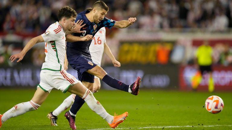 Croatia's Andrej Kramaric, centre, scores his side's opening goal during the Euro 2024 group D qualifying soccer match between Croatia and Wales at the Poljud stadium in Split, Croatia, Saturday, March 25, 2023. (AP Photo/Darko Bandic)