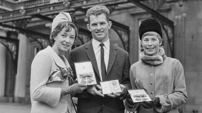 From left to right, British athletes Ann Packer, Robbie Brightwell and Mary Rand receive MBE medals at Buckingham Palace in 1965. Packer and Brightwell were married in 1964.