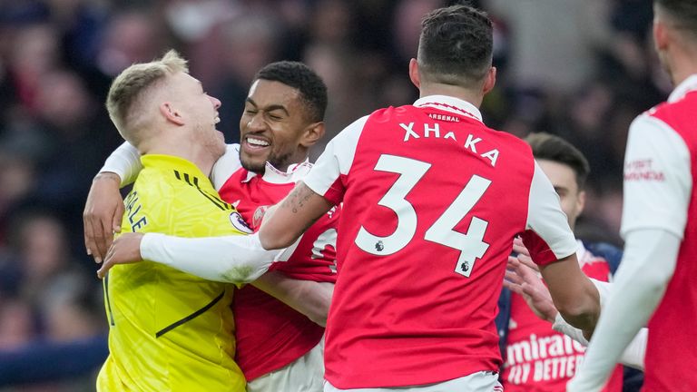 Arsenal's Reiss Nelson, second from left, is congratulated after scoring his side's 3rd goal during the English Premier League soccer match between Arsenal and Bournemouth at the Emirates stadium in London, England, Saturday, March 4, 2023. (AP Photo/Kin Cheung)