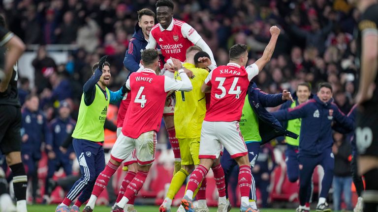 Arsenal's Reiss Nelson is congratulated after scoring his side's 3rd goal during the English Premier League soccer match between Arsenal and Bournemouth at the Emirates stadium in London, England, Saturday, March 4, 2023. (AP Photo/Kin Cheung)