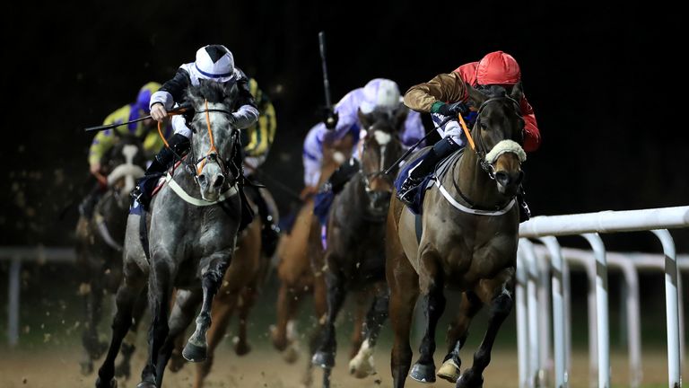 Athmad (red cap) on the way to victory at Wolverhampton