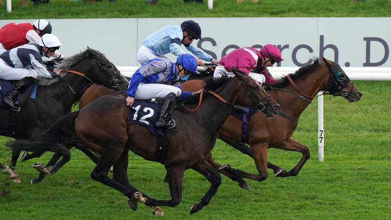 Atrium (black cap) on his way to victory at Doncaster