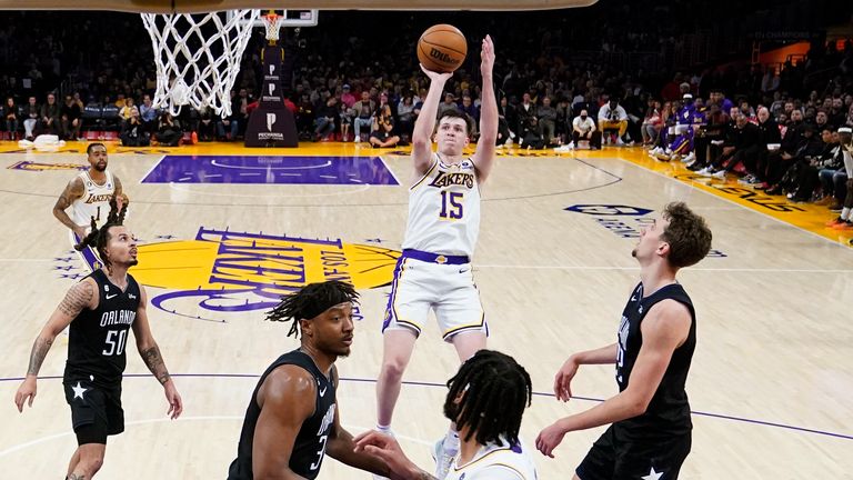 Los Angeles Lakers guard Austin Reaves (15) shoots against the Orlando Magic.