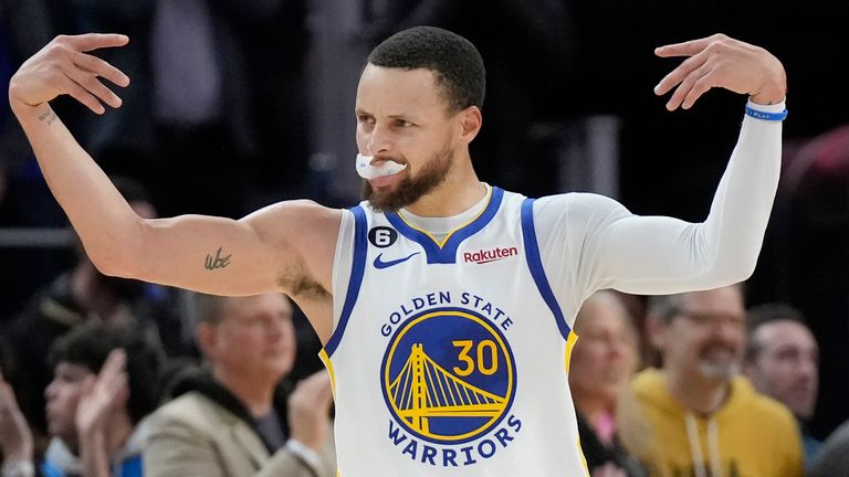 Golden State Warriors guard Stephen Curry (30) gestures to fans during the second half of the team's NBA basketball game against the Philadelphia 76ers in San Francisco, Friday, March 24, 2023. (AP Photo/Jeff Chiu)