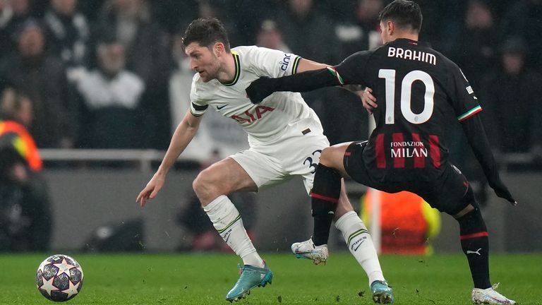 Tottenham's Ben Davies, left, is challenged by AC Milan's Brahim Diaz during the Champions League round of 16 second leg soccer match between Tottenham Hotspur and AC Milan at the Tottenham Hotspur stadium in London, Wednesday, March 8, 2023. (AP Photo/Alastair Grant)
