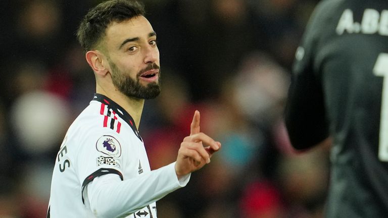 Manchester United's Bruno Fernandes gestures towards Liverpool's goalkeeper Alisson during the English Premier League soccer match between Liverpool and Manchester United at Anfield in Liverpool, England, Sunday, March 5, 2023. (AP Photo/Jon Super)