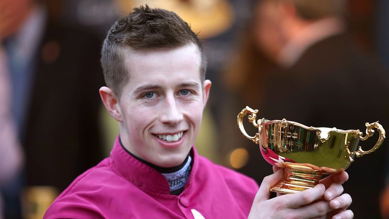 Jockey Bryan Cooper with the Gold Cup after winning on Don Cossack in 2016