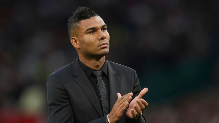 Manchester United's new player Casemiro applauds supporters prior to the start of the English Premier League soccer match between Manchester United and Liverpool at Old Trafford stadium, in Manchester, England, Monday, Aug 22, 2022. (AP Photo/Dave Thompson)