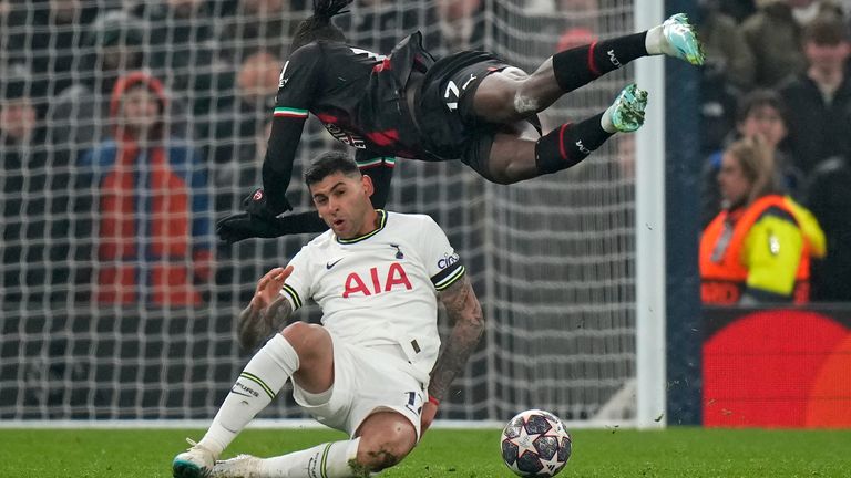 Tottenham's Cristian Romero, bottom, fouls AC Milan's Rafael Leao during the Champions League round of 16 second leg soccer match between Tottenham Hotspur and AC Milan at the Tottenham Hotspur stadium in London, Wednesday, March 8, 2023. (AP Photo/Alastair Grant)