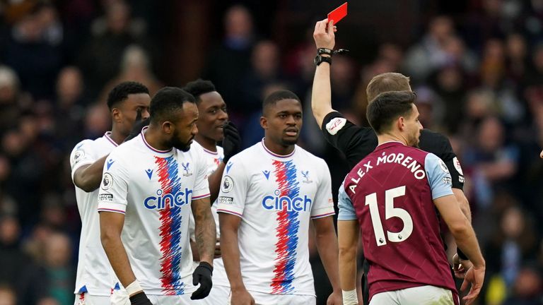 Cheick Doucoure is shown a red card by referee Craig Pawson