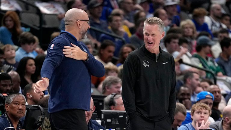 Dallas Mavericks head coach Jason Kidd, left, and Golden State Warriors head coach Steve Kerr, right, talk about the uncontested dunk