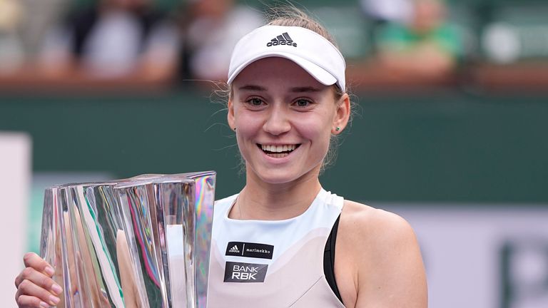 Elena Rybakina, of Kazakhstan, holds up the winner's trophy after defeating Aryna Sabalenka, of Belarus, in the women's singles final at the BNP Paribas Open tennis tournament Sunday, March 19, 2023, in Indian Wells, Calif. (AP Photo/Mark J. Terrill)